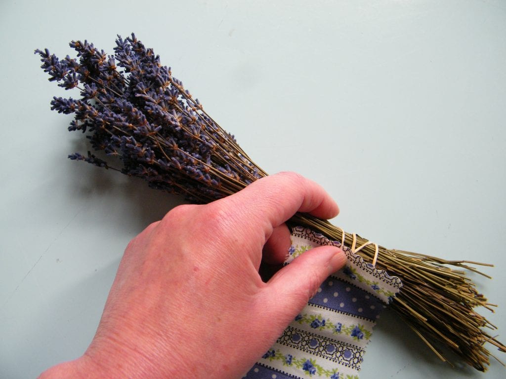 wrap fabric around dry lavender stems